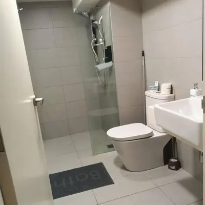 a bathroom with a shower and a toilet and a sink at EkoCheras max5pax Romance Retreats #freeparking #netflix #wifi in Kuala Lumpur