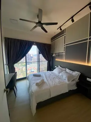 a bedroom with a bed and a ceiling fan at TOP FLOOR 3BR apartment in KL for 6Pax in Kuala Lumpur