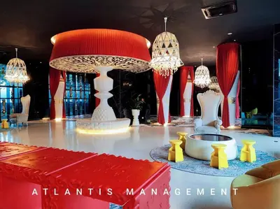 a room with a table with chandeliers and a red and white centerpiece at Arte Mont Kiara in Kuala Lumpur