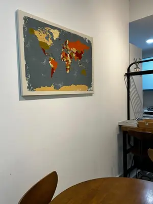 a map of the world hanging on a wall at KLCC Skyhomes near LRT in Kuala Lumpur