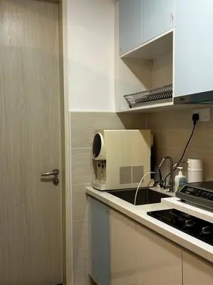 a kitchen with a sink and a microwave at KLCC Skyhomes near LRT in Kuala Lumpur