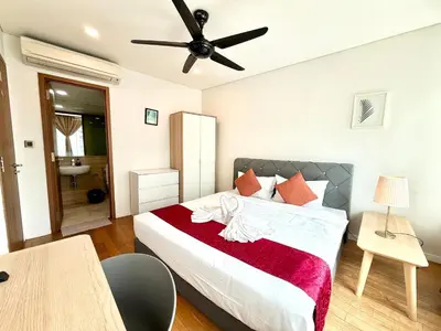 a bedroom with a bed and a ceiling fan at Vortex Hotel Suites & Residence by KLCC in Kuala Lumpur