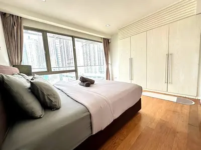 a bedroom with a bed with a teddy bear on it at Bintang Fairlane Residence, KLCC & City View - 2B1R in Kuala Lumpur