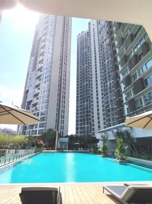 a swimming pool in front of two tall buildings at Swiss Garden Bukit Bintang in Kuala Lumpur