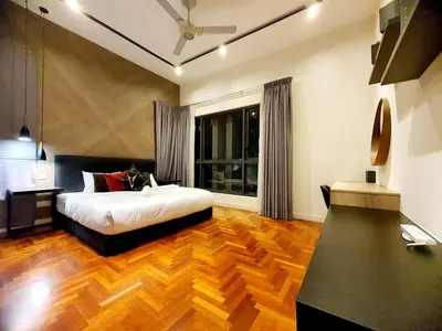a bedroom with a bed and a large window at The Mews KLCC by GBS in Kuala Lumpur