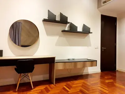 a room with a desk and a mirror on a wall at The Mews KLCC by GBS in Kuala Lumpur