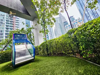 a playground in a city with tall buildings at The Mews KLCC by GBS in Kuala Lumpur