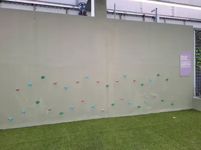 a white wall with a rock wall withaques on it at V Residence Suite at Sunway Velocity in Kuala Lumpur