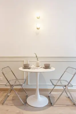 a white table and two chairs in a room at Colony Infinitum By NJ Homes in Kuala Lumpur