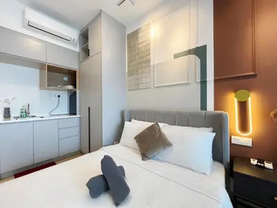 a bedroom with a bed with two pillows at Colony Infinitum By NJ Homes in Kuala Lumpur