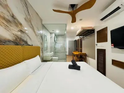 a bedroom with a white bed and a bathroom at Awesomestay apartment walk to Tun Sambathan near KL Sentral in Kuala Lumpur