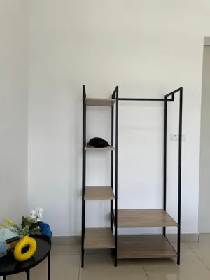 a shelf in a room with a table at trion2 klcc in Kuala Lumpur