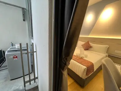 a small bedroom with a bed in a room at The Colony By Infinitum KLCC in Kuala Lumpur