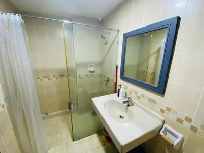 a bathroom with a sink and a shower with a mirror at Homestay Room near KLCC in Kuala Lumpur