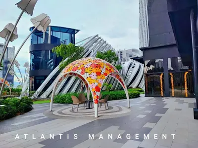 an umbrella with flowers on it in a city at Arte Mon Kiara MK3 Royal Stylist Apartment, Walking Distance to Publika in Kuala Lumpur