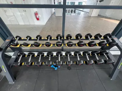 a rack full of dumbbells in a gym at Dreamscape By Reizz Residence in Kuala Lumpur