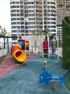 a playground with a slide and a play equipment at Dreamscape By Reizz Residence in Kuala Lumpur