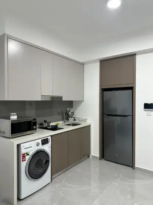 a kitchen with a washing machine and a washer at Agile Residence Bukit Bintang TRX By SweetHome in Kuala Lumpur