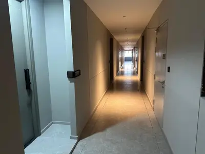 a corridor of a hallway with a long hallway at Agile Residence Bukit Bintang TRX By SweetHome in Kuala Lumpur