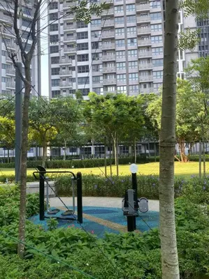 a park with a playground with a swing at 4BR Modish Room MVertica Near MRT by RumaBnB in Kuala Lumpur