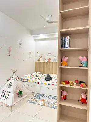 a childs bedroom with a bed and a book shelf at Vivo Soho Suite-5pax-Next to Midvalley, KL center in Kuala Lumpur