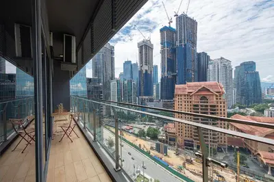 a view of a city from a building balcony at 1-6pax Dorsett KL 3mins to Pavilion Infinity Pool in Kuala Lumpur