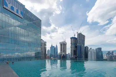 a swimming pool on top of a city skyline at 1-6pax Dorsett KL 3mins to Pavilion Infinity Pool in Kuala Lumpur