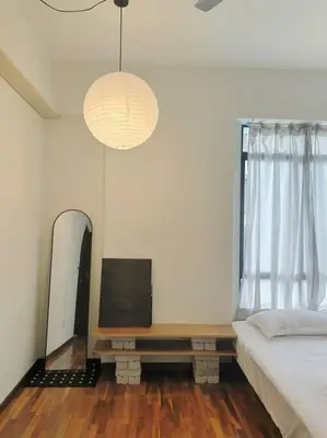 a bedroom with a bed and a table and a mirror at Spacious 4BR condo near KLCC - Travel with MRT in Kuala Lumpur