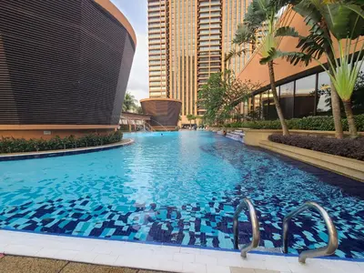a large swimming pool in the middle of a building at Premier CityView Times Square Apartment KL in Kuala Lumpur