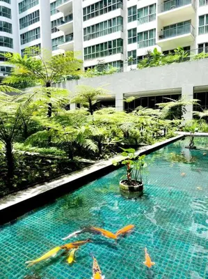 a large swimming pool in front of a building at 2br 2ba in the heart of KL, Regalia Residence in Kuala Lumpur