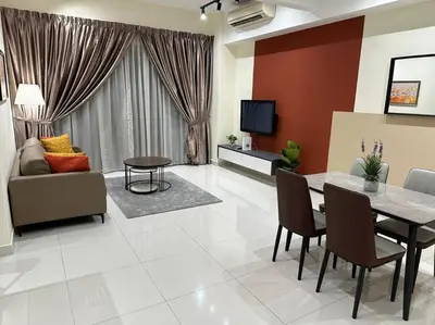 a living room with a table and a couch at 2br 2ba in the heart of KL, Regalia Residence in Kuala Lumpur