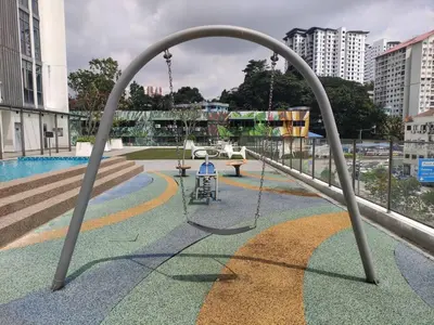 an empty playground with a swing and a swing at Vivo Soho Suites by Luvit Stay in Kuala Lumpur