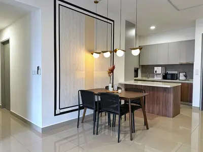 a dining room with a table and chairs in a kitchen at M Vertica By Seroja Coliving in Kuala Lumpur