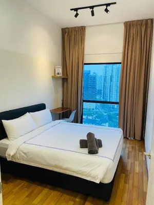 a bedroom with a bed and a large window at Reizz Residence Zen Den in Kuala Lumpur