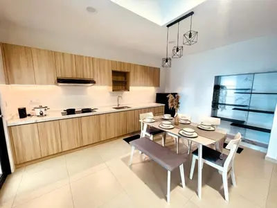 a kitchen and dining room with a table and chairs at Reizz Residence Zen Den in Kuala Lumpur