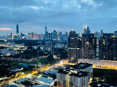 a view of a city at night with buildings at Reizz Residence Zen Den in Kuala Lumpur