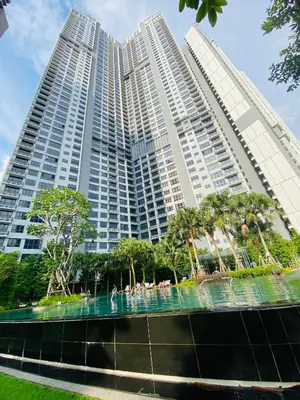 a large building with a fountain in front of it at Agile Signature Suites KL in Kuala Lumpur