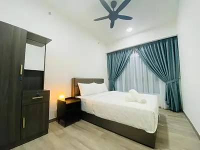 a bedroom with a bed and a ceiling fan at Agile Signature Suites KL in Kuala Lumpur