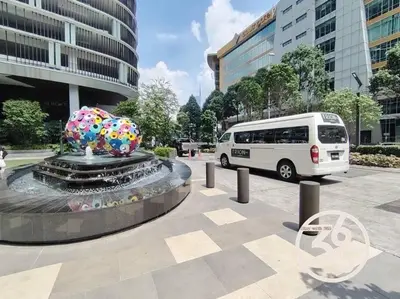 a white van parked next to a fountain in a city at 4Pax Trion Superior 1 Bedroom \u4e2d\u6587\u623f\u4e1c in Kuala Lumpur