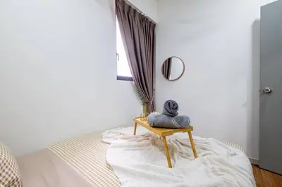 a bedroom with a bed with a table and a mirror at Bea Bea's Kidz Dreamland Mini Horse 4br 11pax MRT in Kuala Lumpur