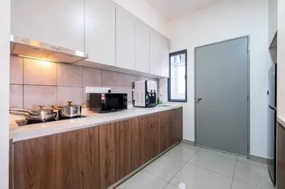 a kitchen with a counter with a microwave and a stove at Bea Bea's Kidz Dreamland Mini Horse 4br 11pax MRT in Kuala Lumpur