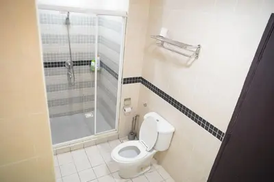 a bathroom with a toilet and a shower at The Luxe Apartment 2 Bedrooms in Kuala Lumpur