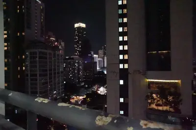 a view of a city skyline at night at The Luxe Apartment 2 Bedrooms in Kuala Lumpur