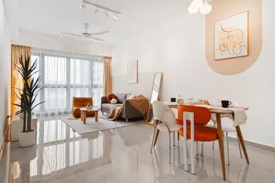 a white living room with a table and chairs at Agile Bukit Bintang in Kuala Lumpur