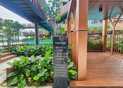 a sign in the middle of a garden at KLCC view appartment in Kuala Lumpur