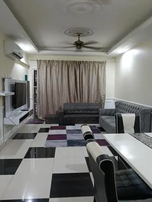 a living room with a couch and a table at Homestay Bondaku HUKM Cheras Kuala Lumpur in Kuala Lumpur