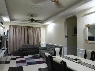 a waiting room with a couch and a table at Homestay Bondaku HUKM Cheras Kuala Lumpur in Kuala Lumpur