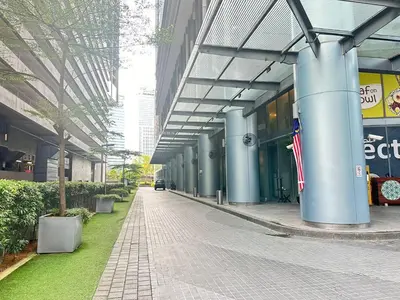 an empty hallway of a building with an american flag at Summer Suites klcc by kuala lumpur in Kuala Lumpur