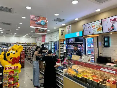 a group of people standing in a grocery store at Summer Suites klcc by kuala lumpur in Kuala Lumpur
