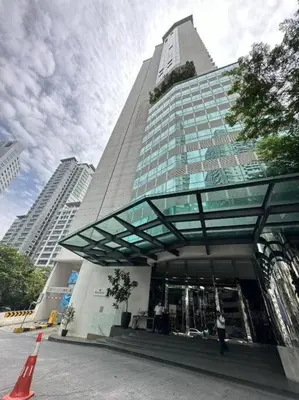 a tall building with a person standing in front of it at One Bukit Ceylon At Pavilion Bukit Bintang in Kuala Lumpur